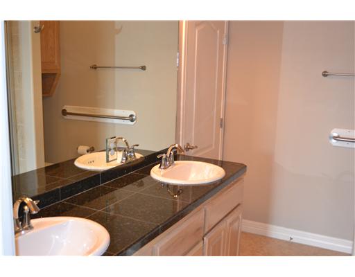 4750 Grand Junction Drive Corpus Christi, TX 78413 - Photo 6 of 7 a bathroom with a sink and a mirror