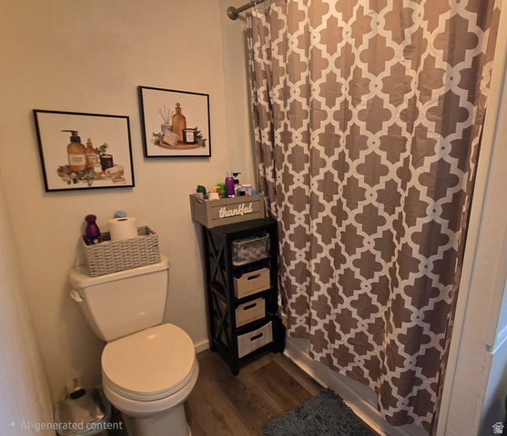 1500 Angel Street North, Unit 53 Layton, UT 84041 - Photo 10 of 20 Bathroom featuring a standard toilet, wood-finish flooring, and a shower with a patterned curtain