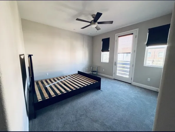 a view of an empty room with windows