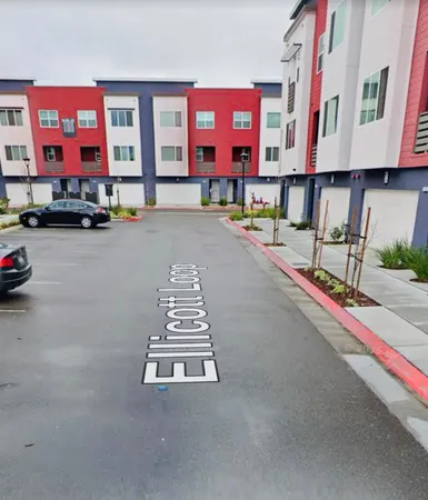 a view of a street with cars