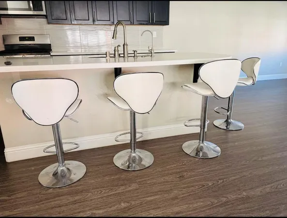 a table with chairs and a wooden floor
