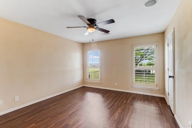 a bathroom with a double vanity sink a mirror and a shower
