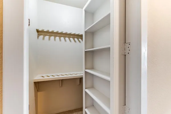 a bathroom with a sink vanity mirror and toilet