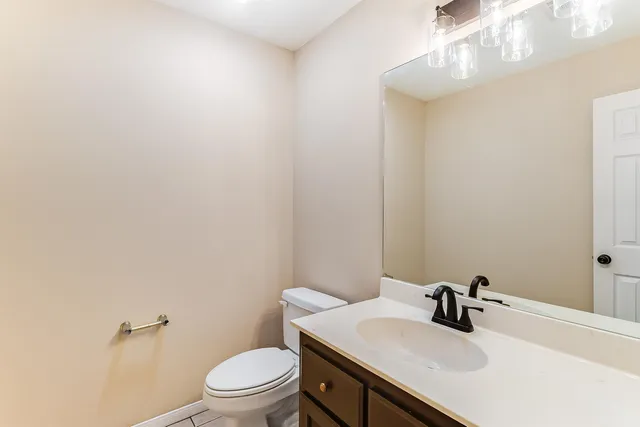 a room with cabinets and stainless steel appliances