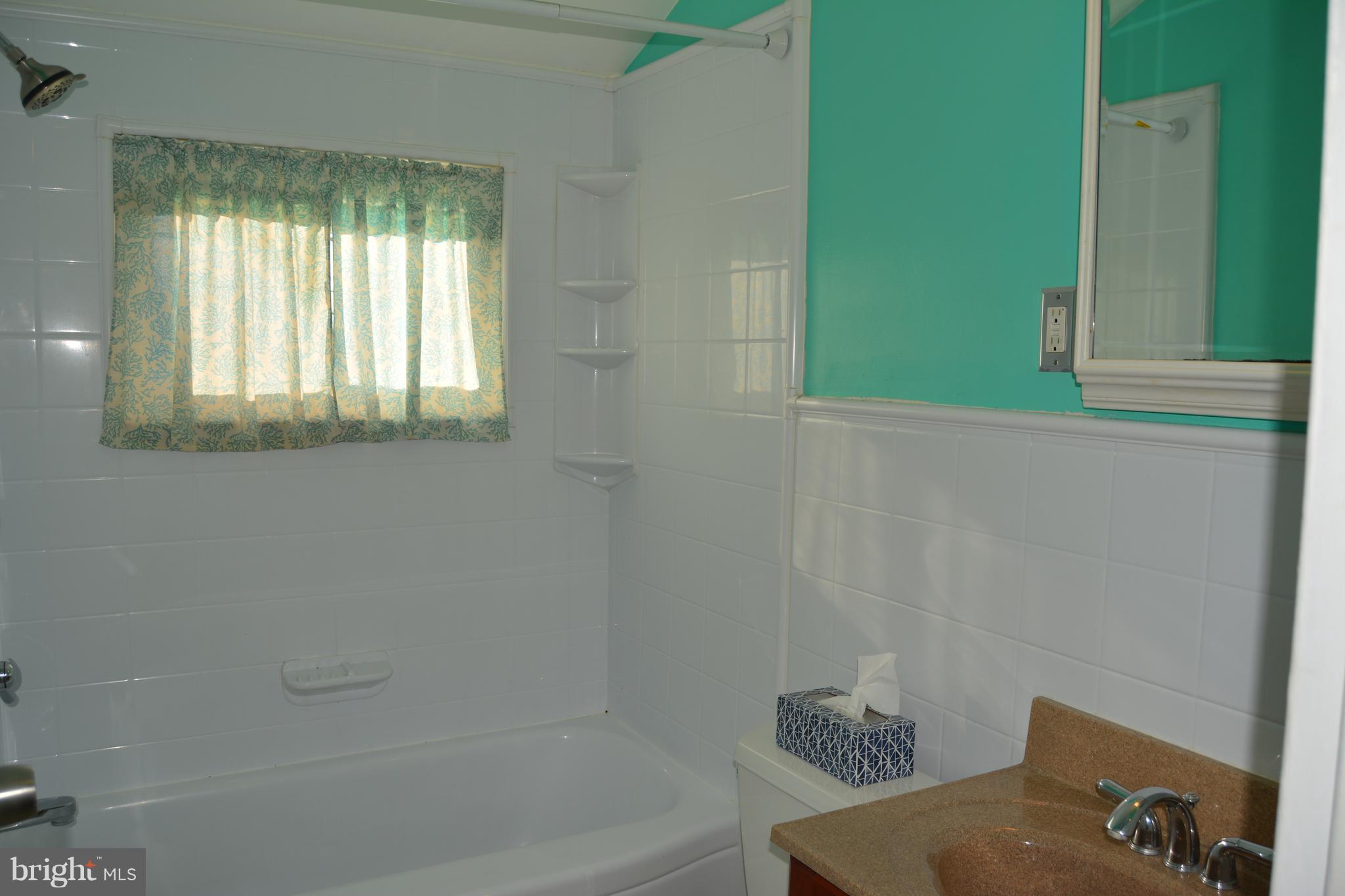8004 Charlesmont Road Baltimore, MD 21222 - Photo 10 of 18 a bathroom with a bathtub