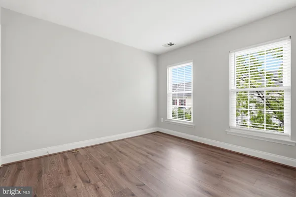 a bedroom with a large bed and a couch