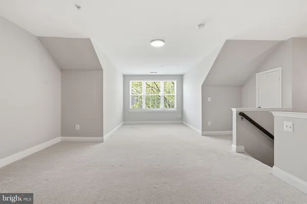 a view of an empty room with stairs