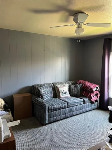 a bathroom with a shower curtain and toilet