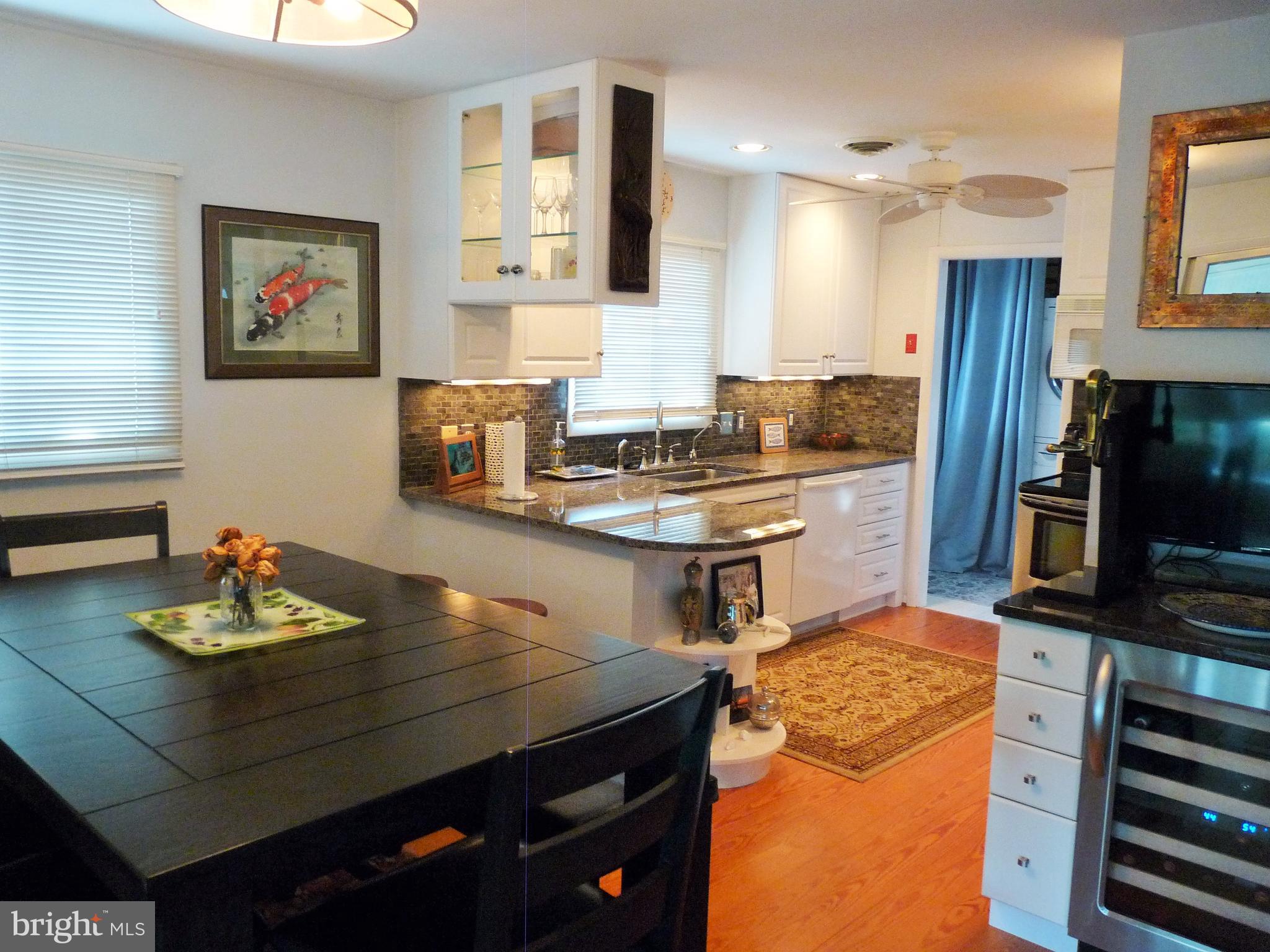102 Point Road Stevensville, MD 21666 - Photo 14 of 41 View from the dining area into the kitchen