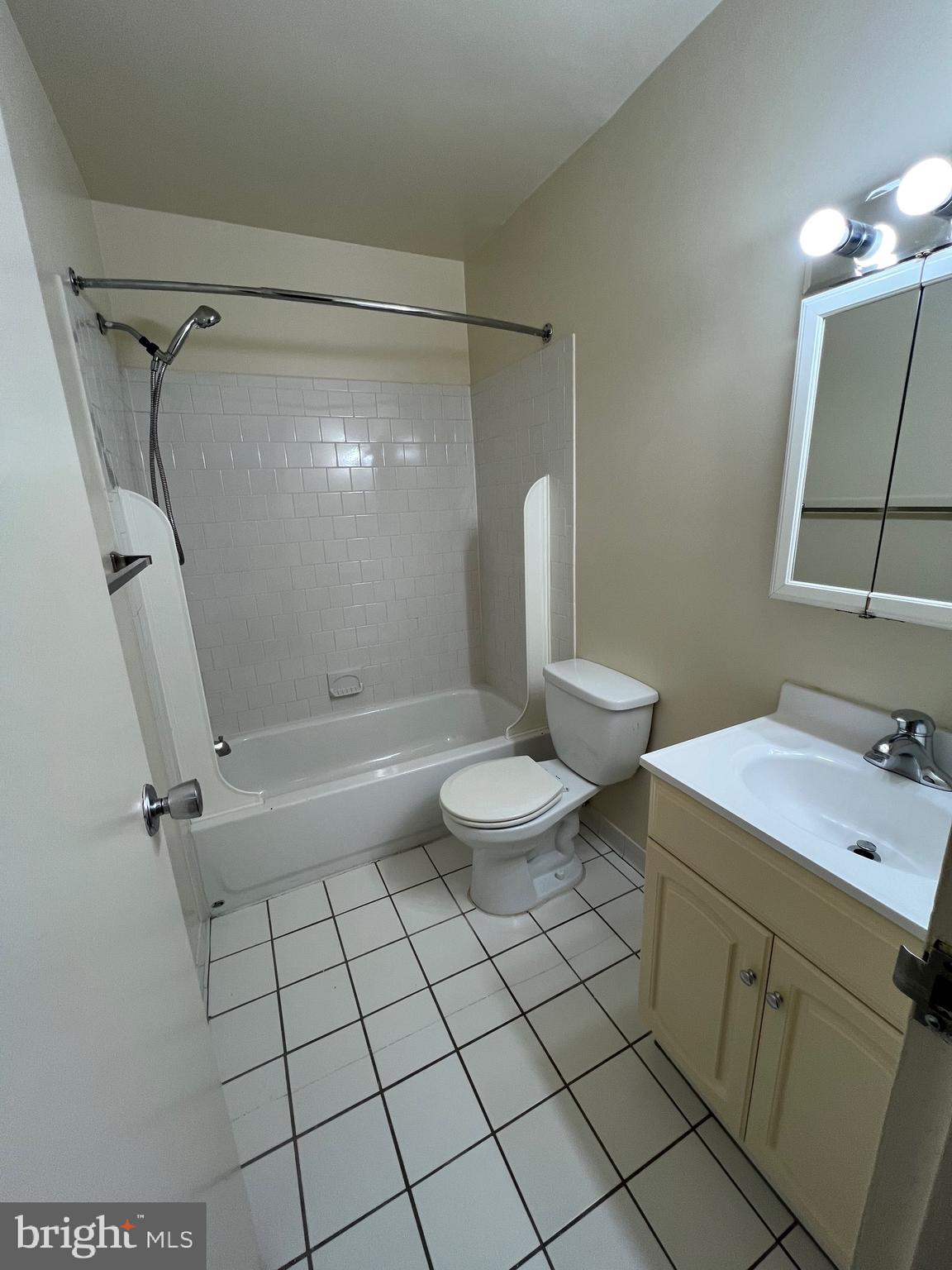 4645 Logsdon Drive Annandale, VA 22003 - Photo 16 of 20 a bathroom with a sink mirror vanity and toilet