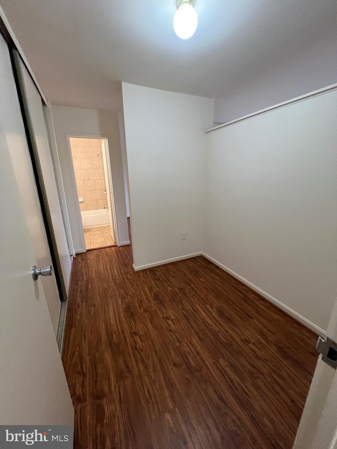4645 Logsdon Drive Annandale, VA 22003 - Photo 17 of 20 a view of empty room with wooden floor and fan