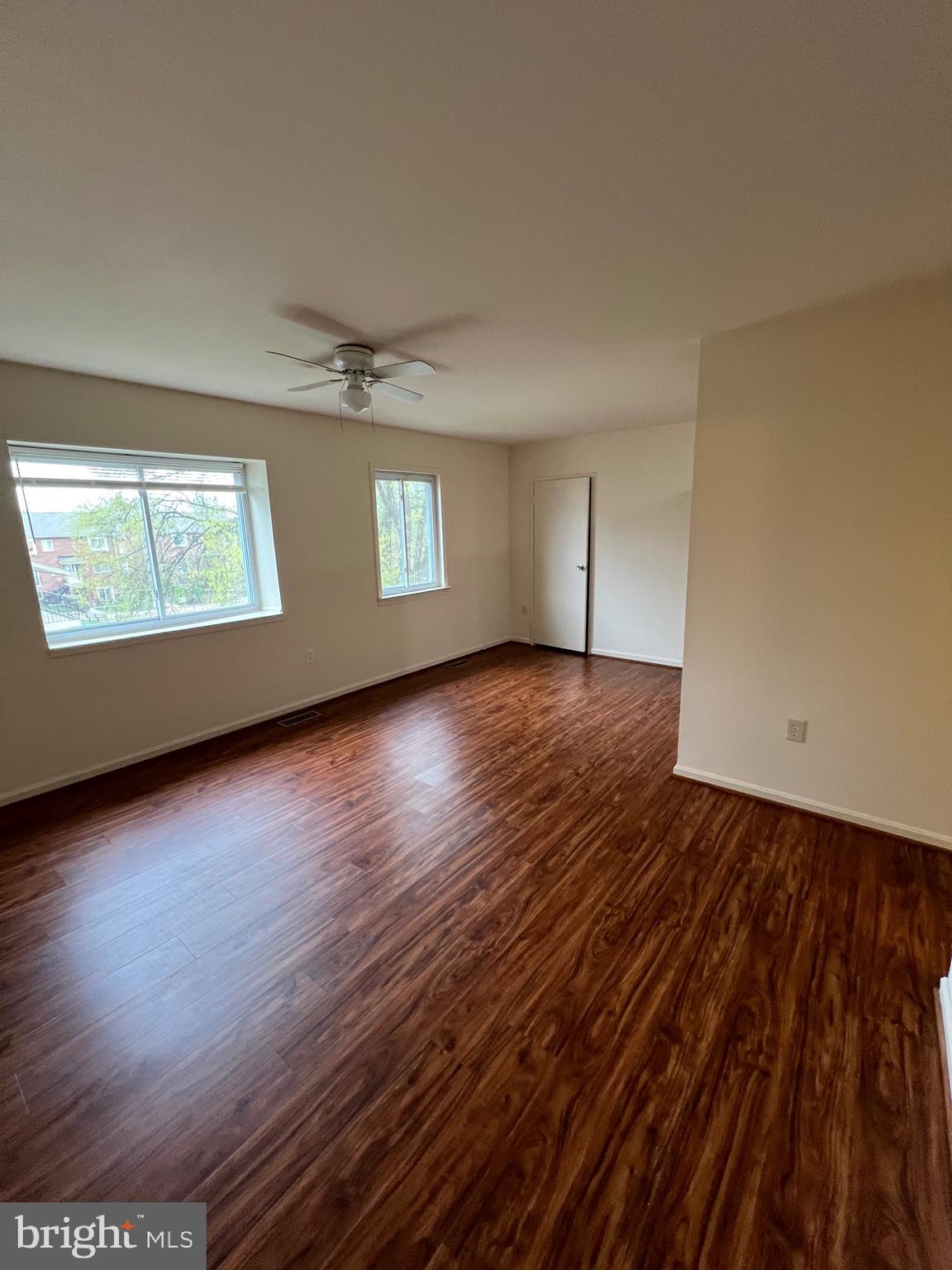 4645 Logsdon Drive Annandale, VA 22003 - Photo 18 of 20 an empty room with wooden floor and windows