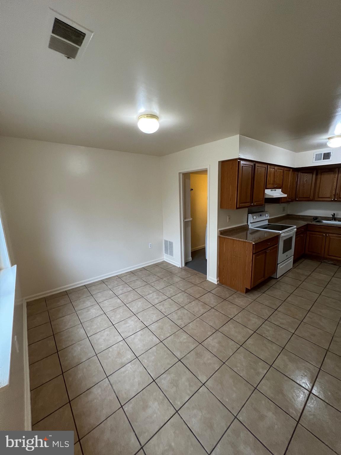 4645 Logsdon Drive Annandale, VA 22003 - Photo 5 of 20 a view of kitchen with refrigerator and cabinets