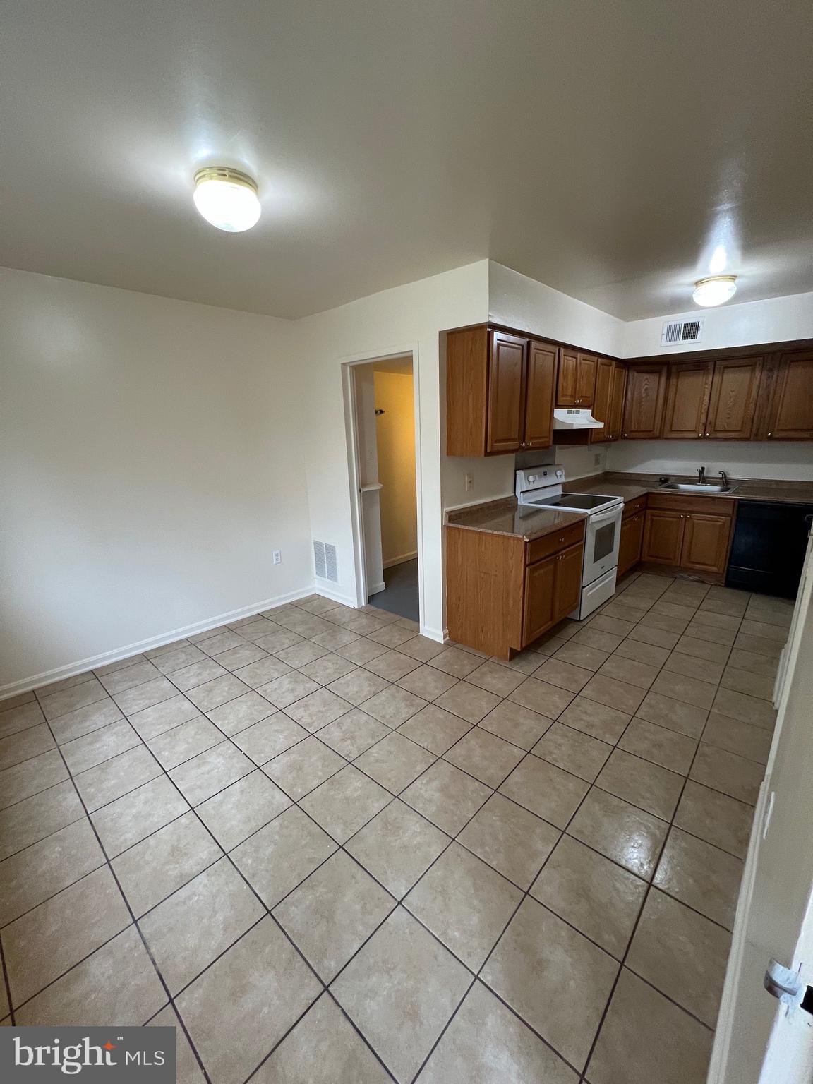 4645 Logsdon Drive Annandale, VA 22003 - Photo 6 of 20 a kitchen with granite countertop a sink and cabinets