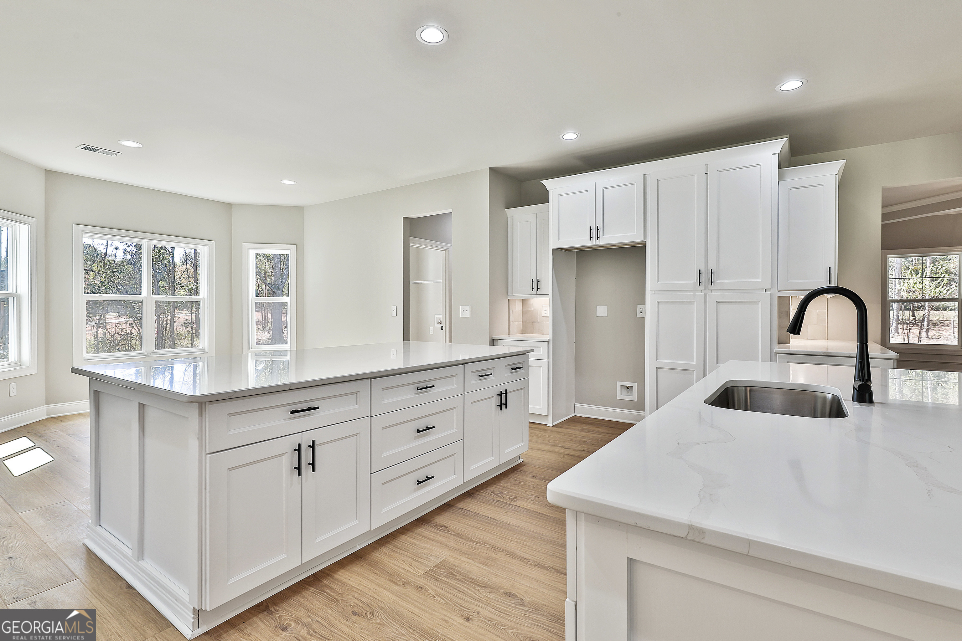 779 Alex Stephens Road Moreland, GA 30259 - Photo 20 of 54 a kitchen with granite countertop white cabinets and sink