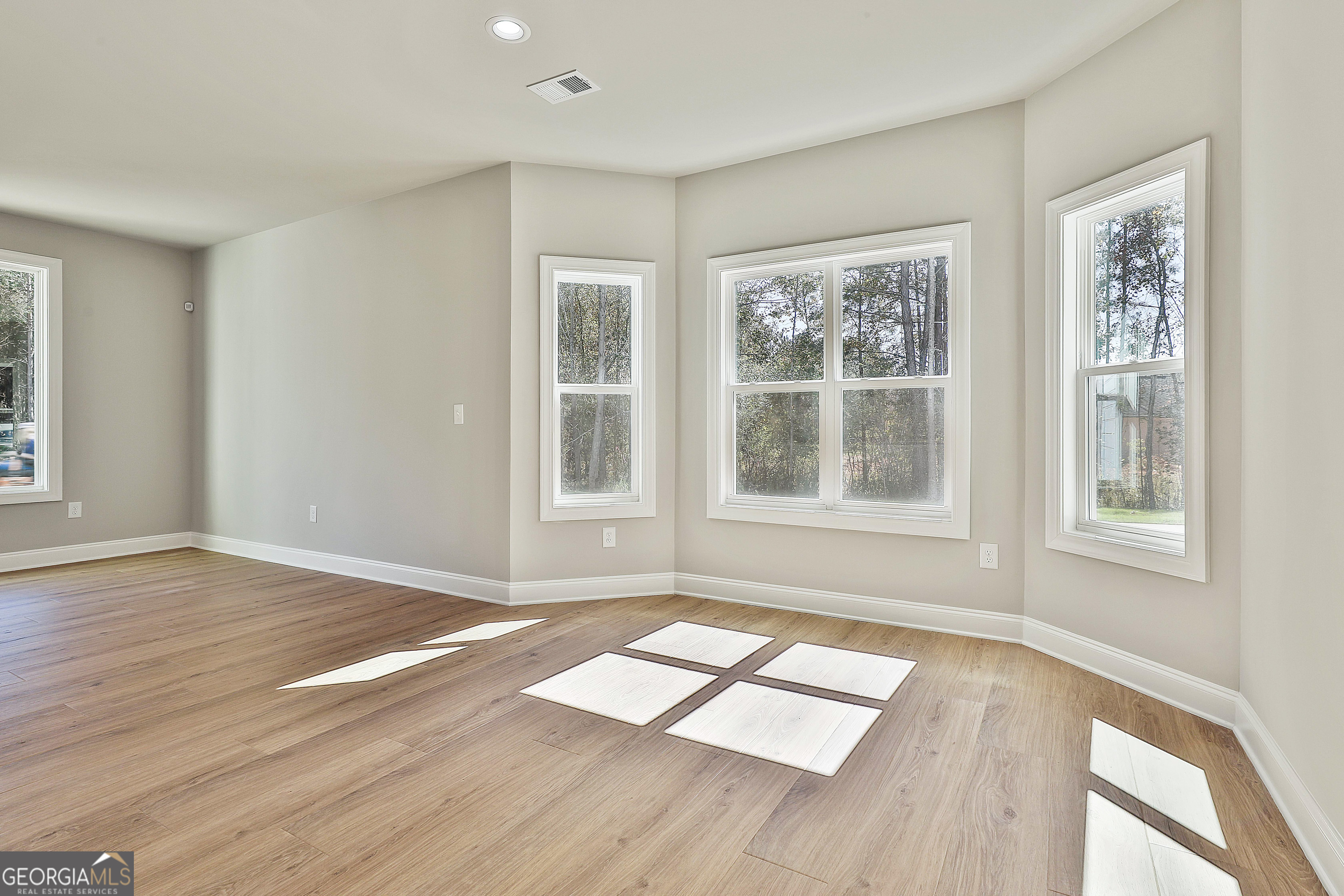779 Alex Stephens Road Moreland, GA 30259 - Photo 24 of 54 a view of an empty room with wooden floor and a window
