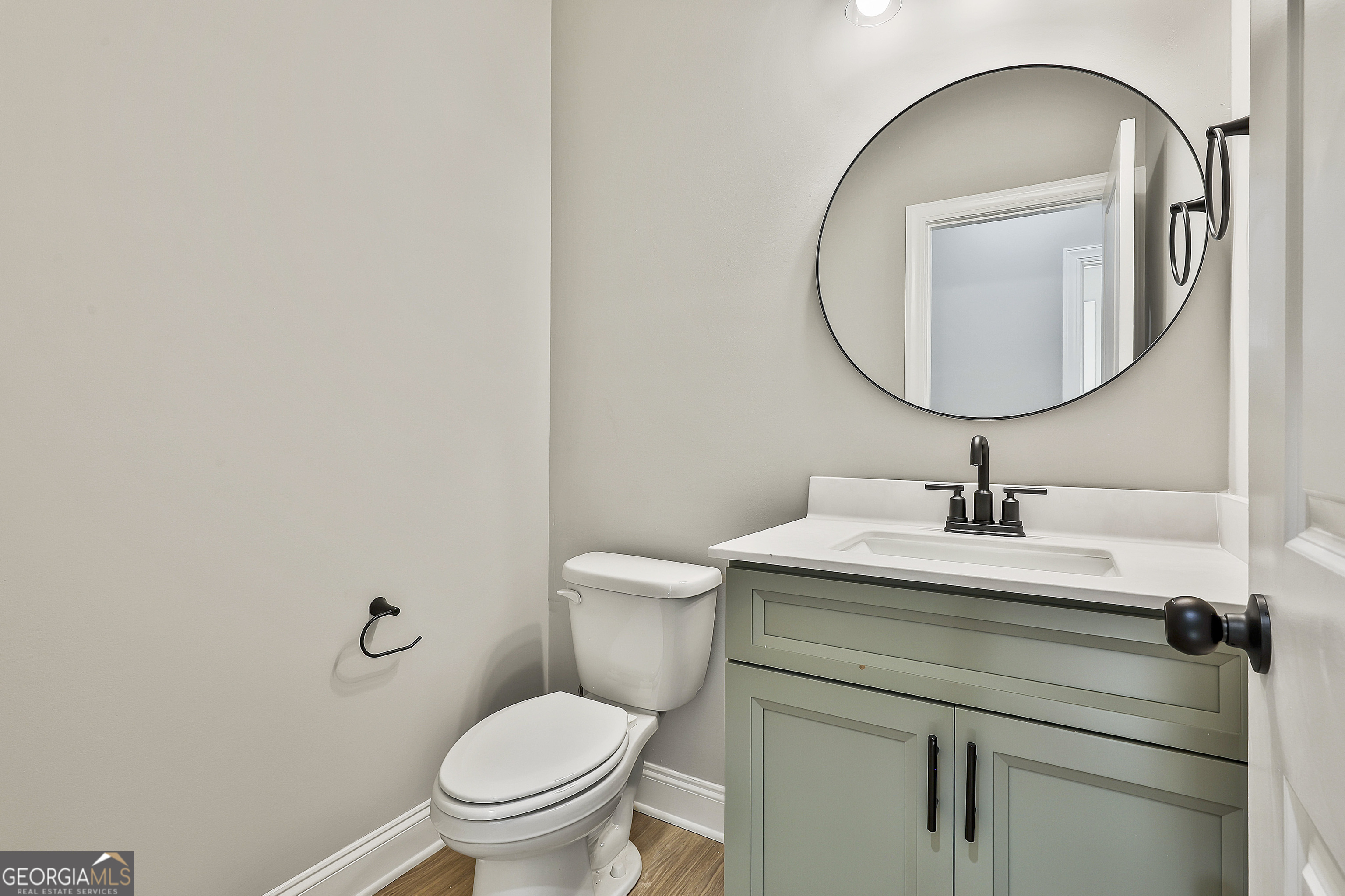 779 Alex Stephens Road Moreland, GA 30259 - Photo 29 of 54 a bathroom with a sink a toilet and a mirror