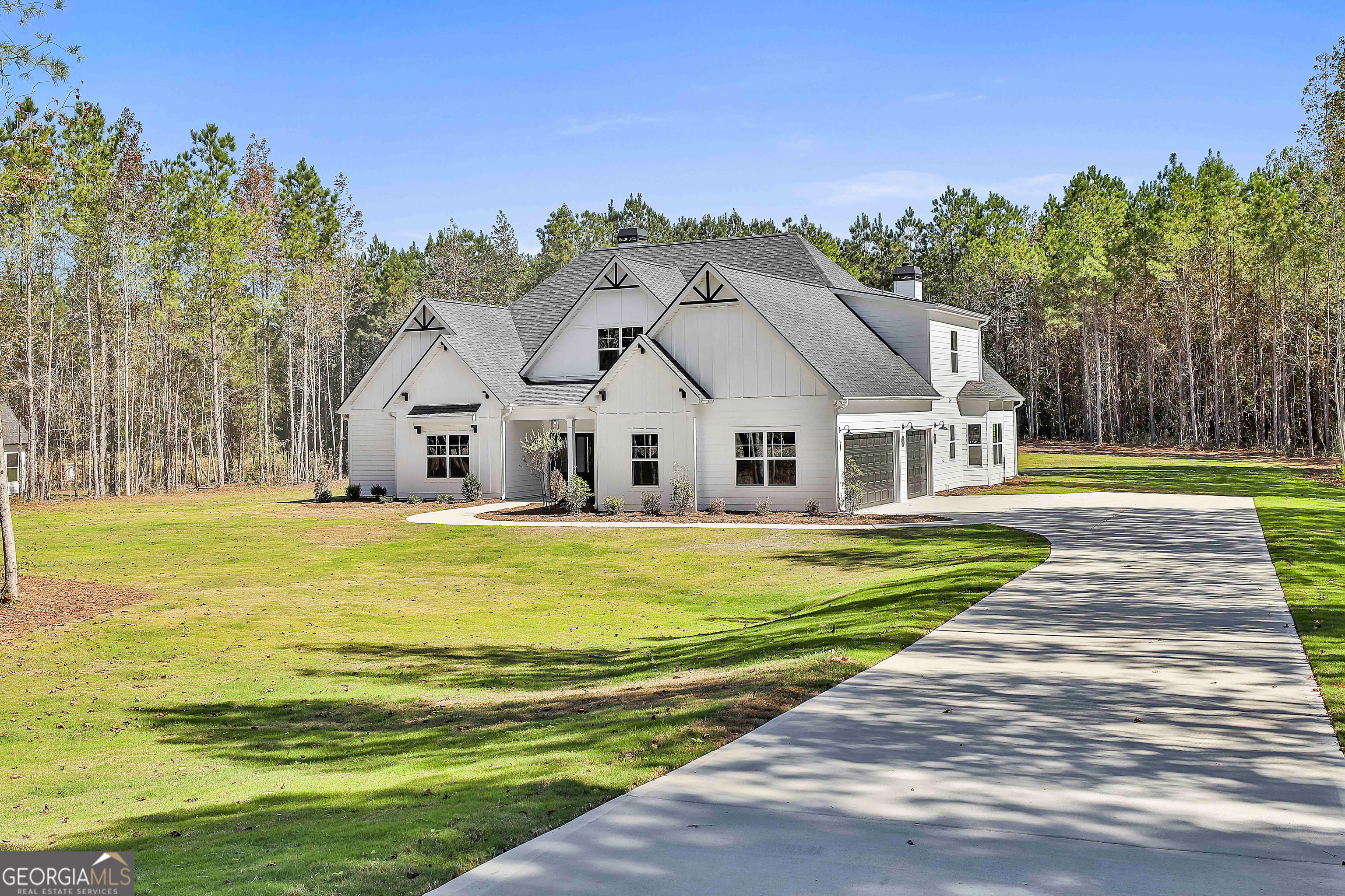 779 Alex Stephens Road Moreland, GA 30259 - Photo 3 of 54 a view of a white house with a big yard and potted plants by side of it