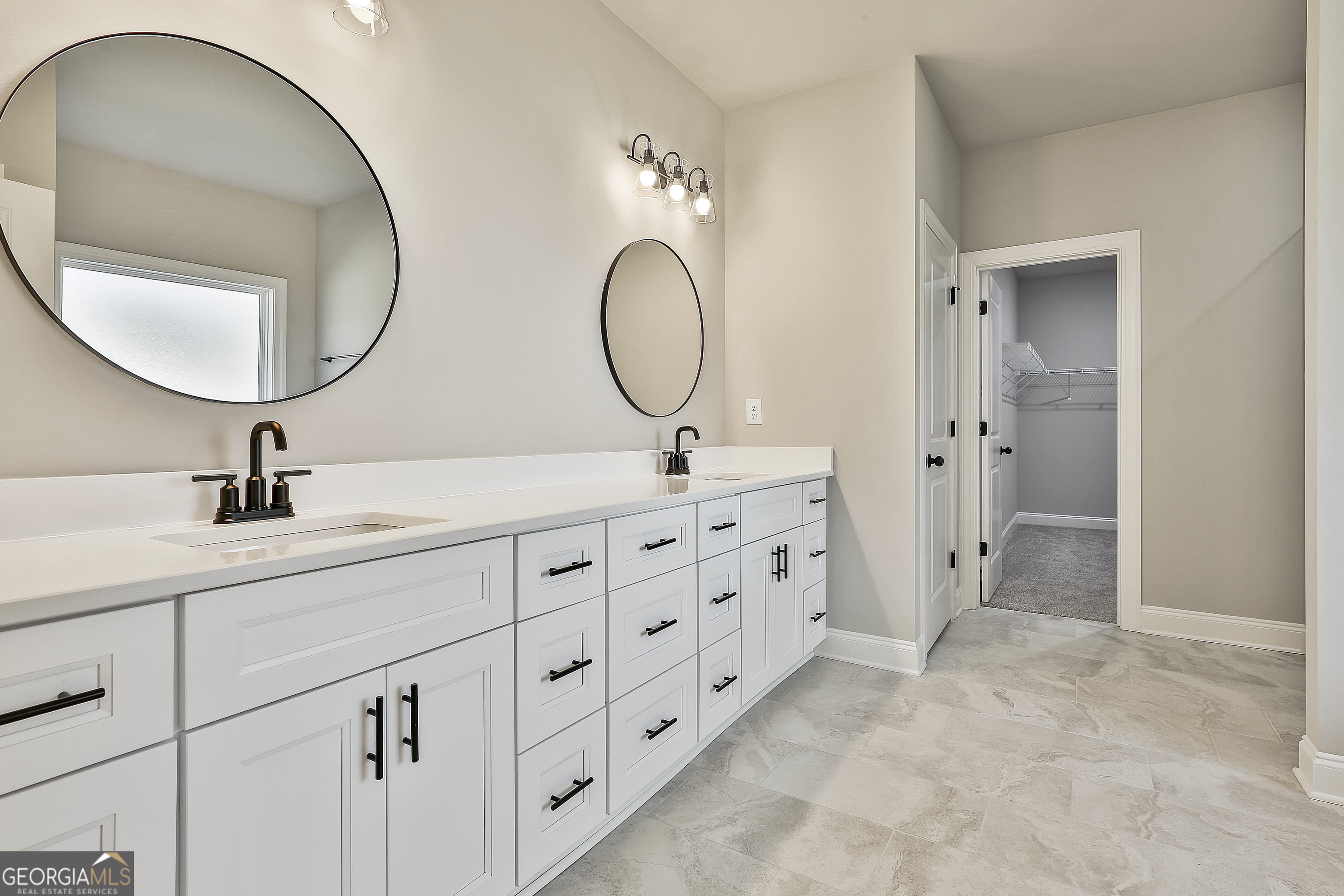 779 Alex Stephens Road Moreland, GA 30259 - Photo 33 of 54 a bathroom with a double vanity sink and a mirror