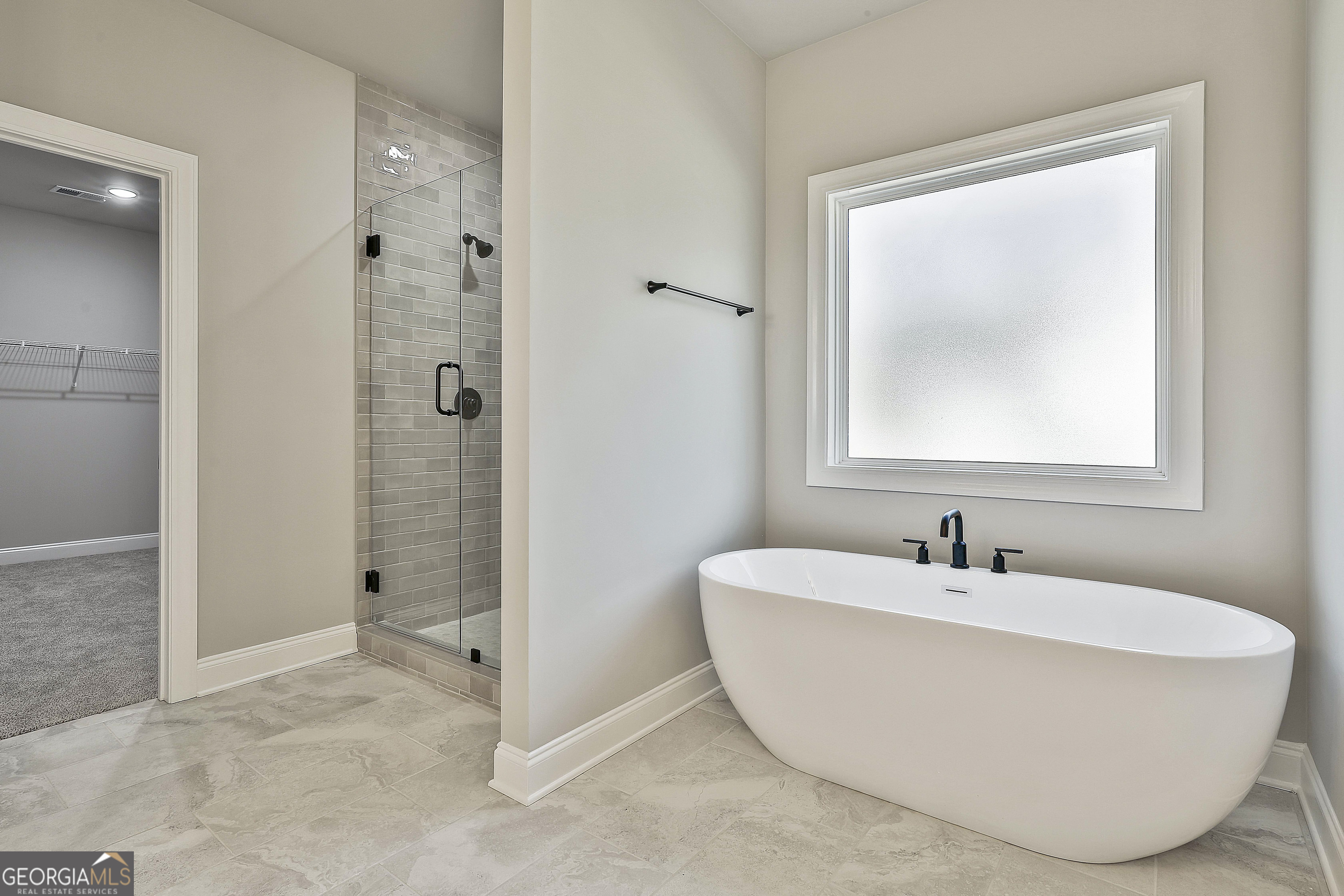 779 Alex Stephens Road Moreland, GA 30259 - Photo 34 of 54 a spacious bathroom with a bathtub and shower
