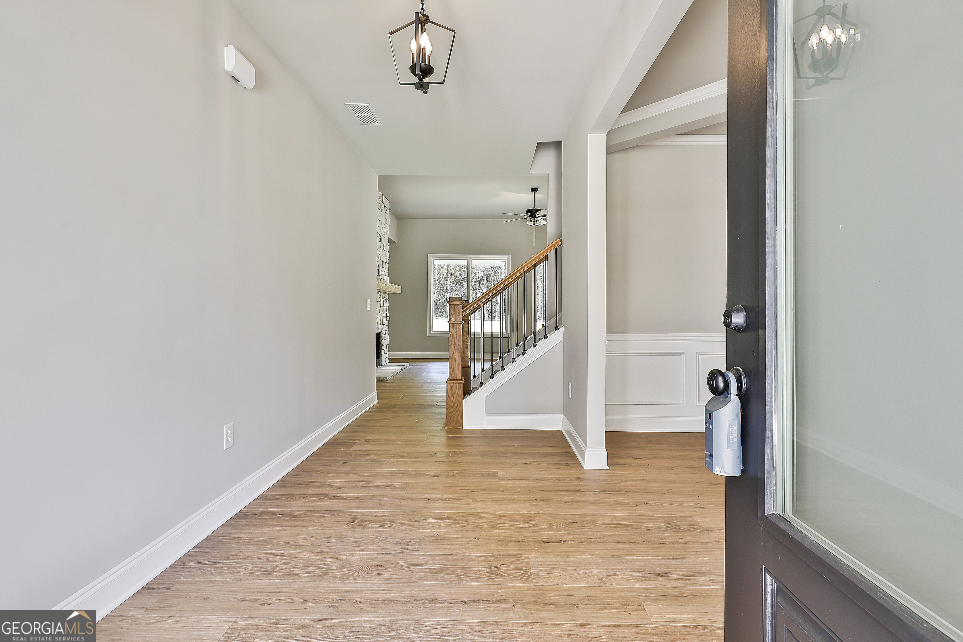 779 Alex Stephens Road Moreland, GA 30259 - Photo 6 of 54 a view of a hallway with wooden floor and staircase