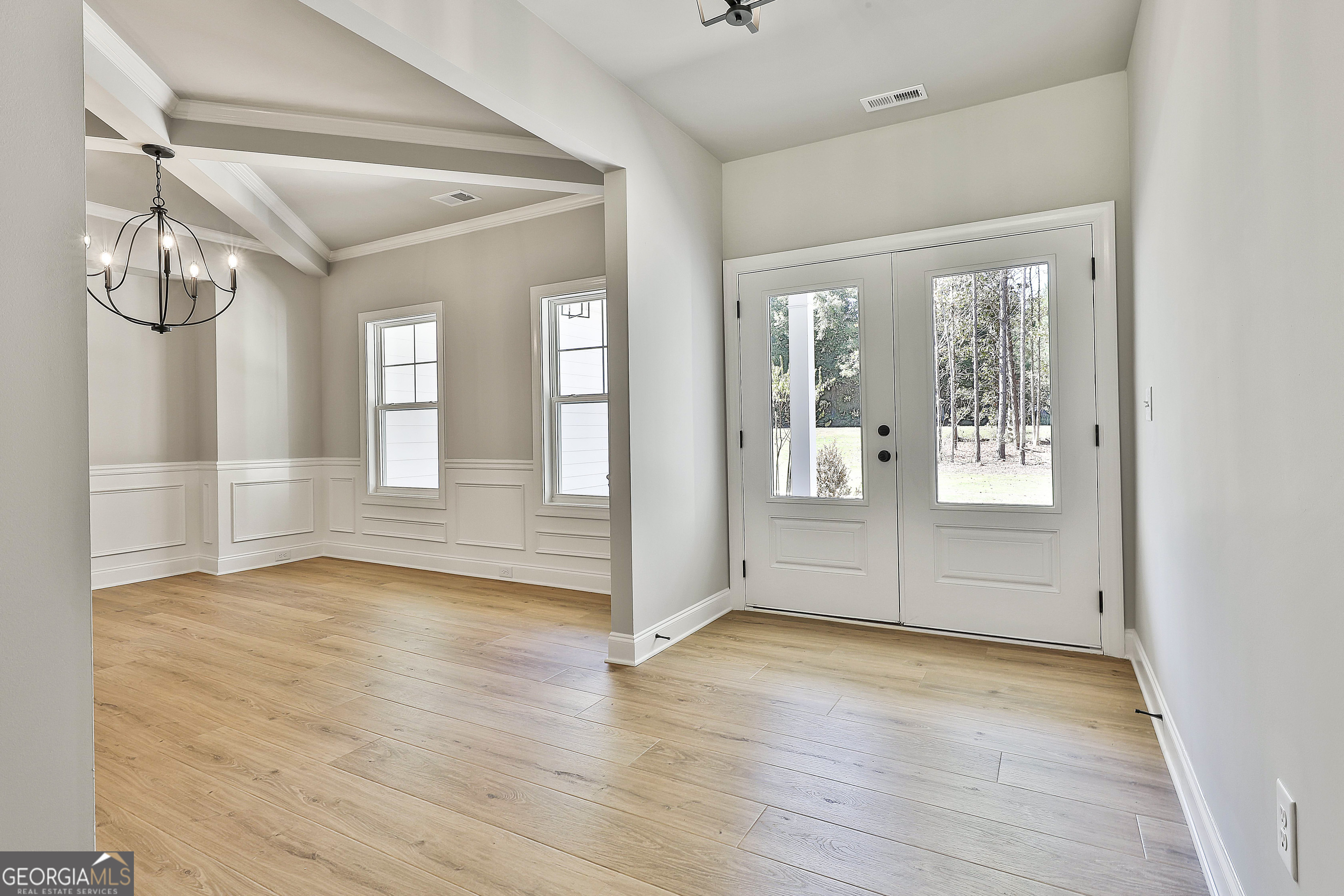 779 Alex Stephens Road Moreland, GA 30259 - Photo 7 of 54 a view of an empty room with wooden floor and a window