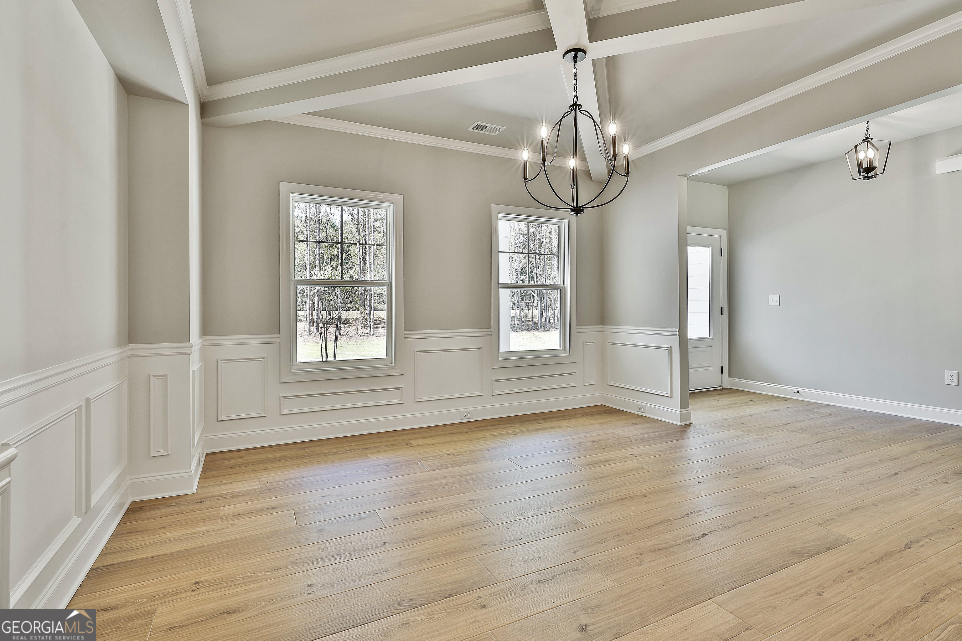 779 Alex Stephens Road Moreland, GA 30259 - Photo 9 of 54 a view of empty room with wooden floor and fan