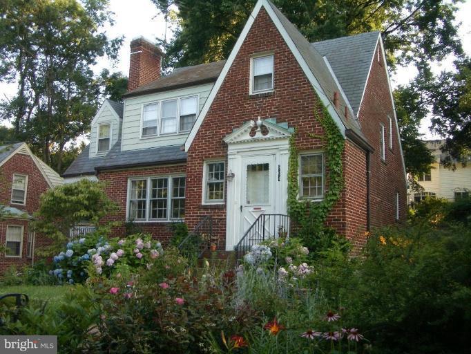 804 Rowen Road Silver Spring, MD 20910 - Photo 2 of 22 a front view of a house with a garden