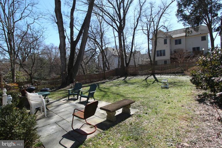 804 Rowen Road Silver Spring, MD 20910 - Photo 14 of 22 a view of a bench in a backyard