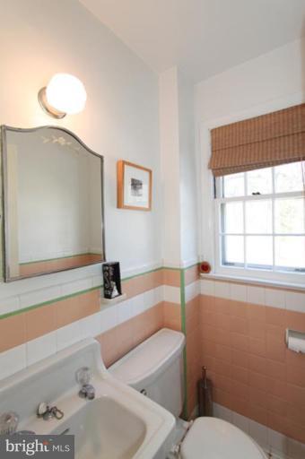 804 Rowen Road Silver Spring, MD 20910 - Photo 16 of 22 a bathroom with a sink and a toilet