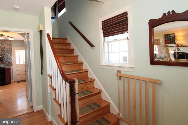804 Rowen Road Silver Spring, MD 20910 - Photo 17 of 22 a view of entryway and hall with wooden floor