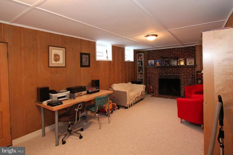 804 Rowen Road Silver Spring, MD 20910 - Photo 21 of 22 a livingroom with furniture and a fireplace