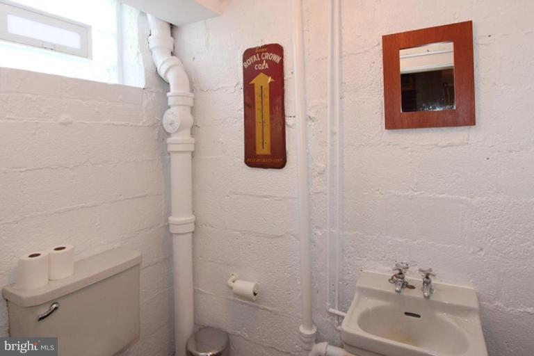 804 Rowen Road Silver Spring, MD 20910 - Photo 22 of 22 a bathroom with a toilet and a sink