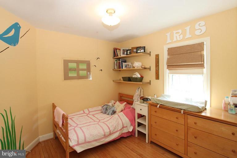 804 Rowen Road Silver Spring, MD 20910 - Photo 5 of 22 a bedroom with a bed and a window