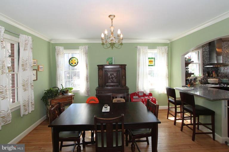 804 Rowen Road Silver Spring, MD 20910 - Photo 6 of 22 a view of a dining room with furniture and wooden floor
