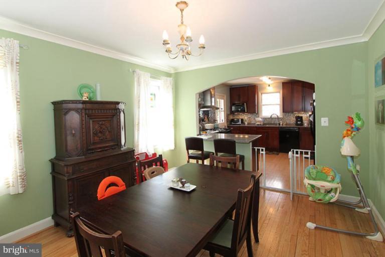 804 Rowen Road Silver Spring, MD 20910 - Photo 7 of 22 a view of a dining room with furniture and chandelier