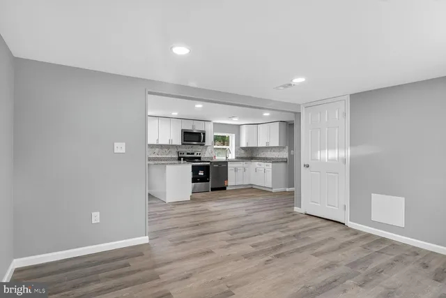 a view of kitchen with wooden floor