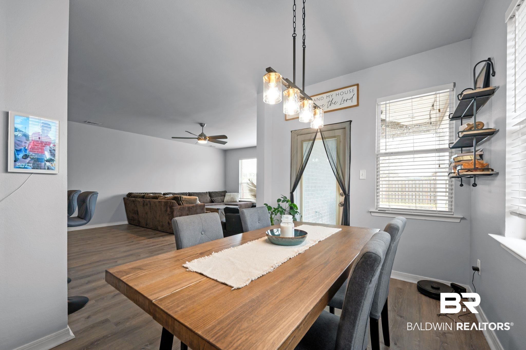 1287 Pembroke Way Foley, AL 36535 - Photo 13 of 39 Dining space with dark wood-type flooring and a ceiling fan
