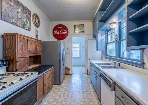 a kitchen with stainless steel appliances granite countertop a stove and a sink