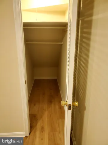 an empty room with wooden floor