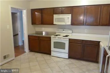 a kitchen with a stove and a microwave
