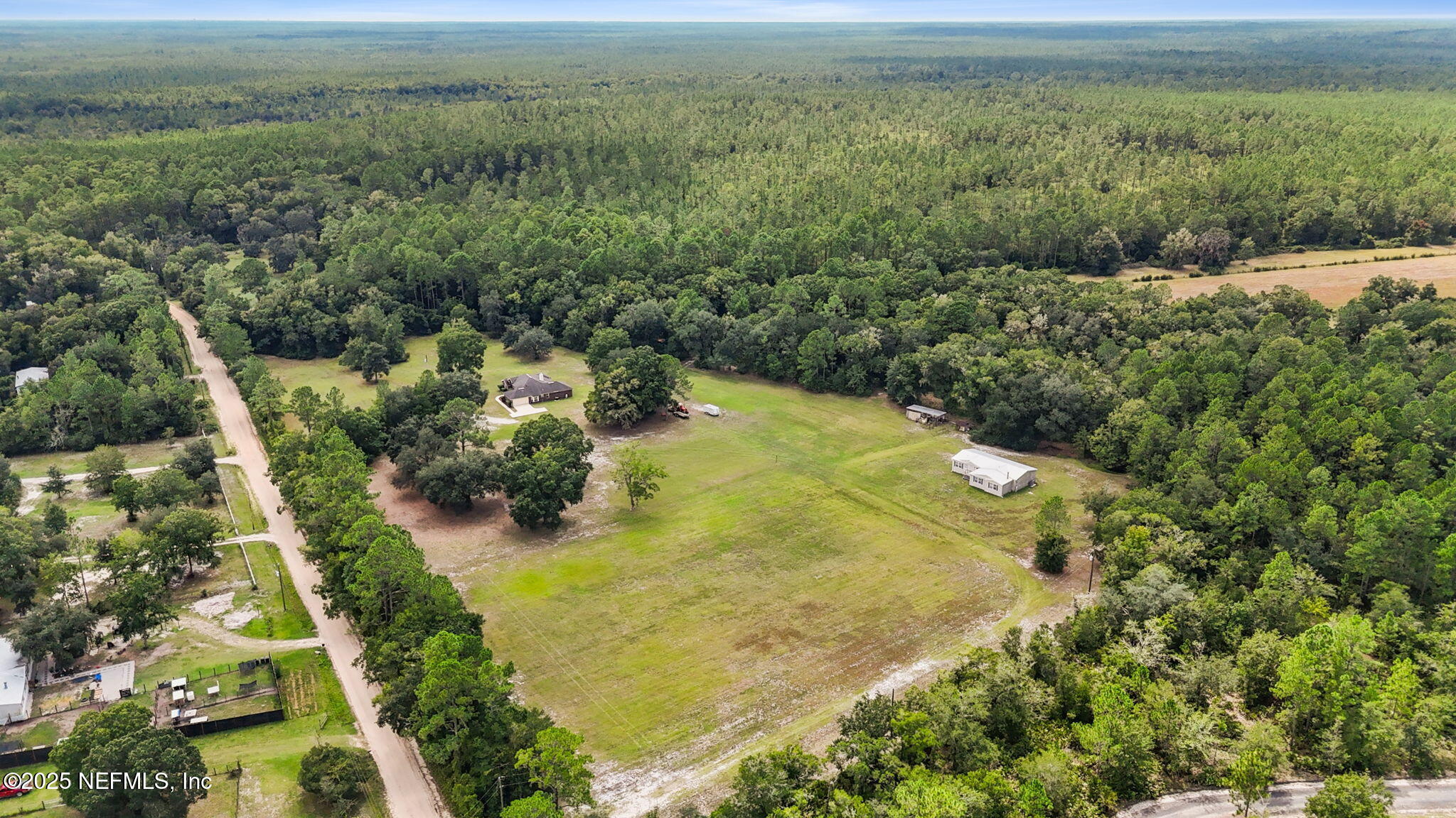 2064 Louie Carter Road Jacksonville, FL 32234 - Photo 11 of 46 a view of a houses with a yard