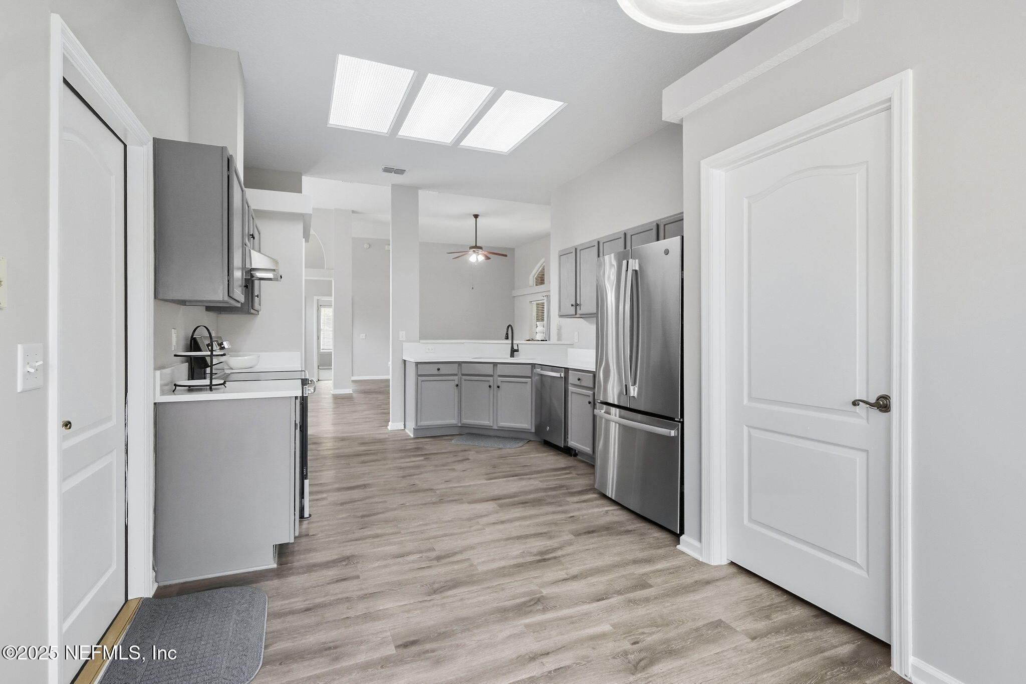 2064 Louie Carter Road Jacksonville, FL 32234 - Photo 22 of 46 a kitchen with a refrigerator sink and cabinets