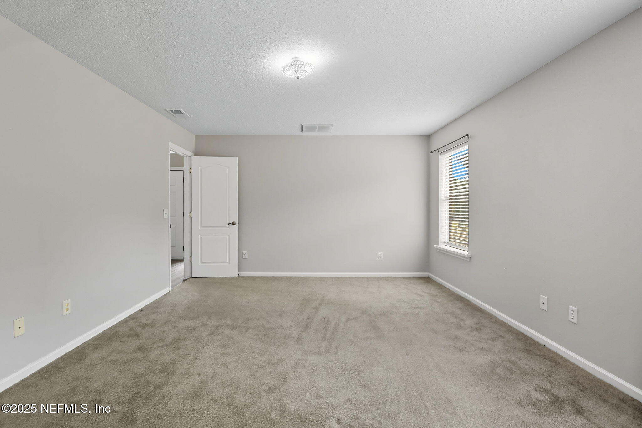 2064 Louie Carter Road Jacksonville, FL 32234 - Photo 29 of 46 a view of an empty room with a window