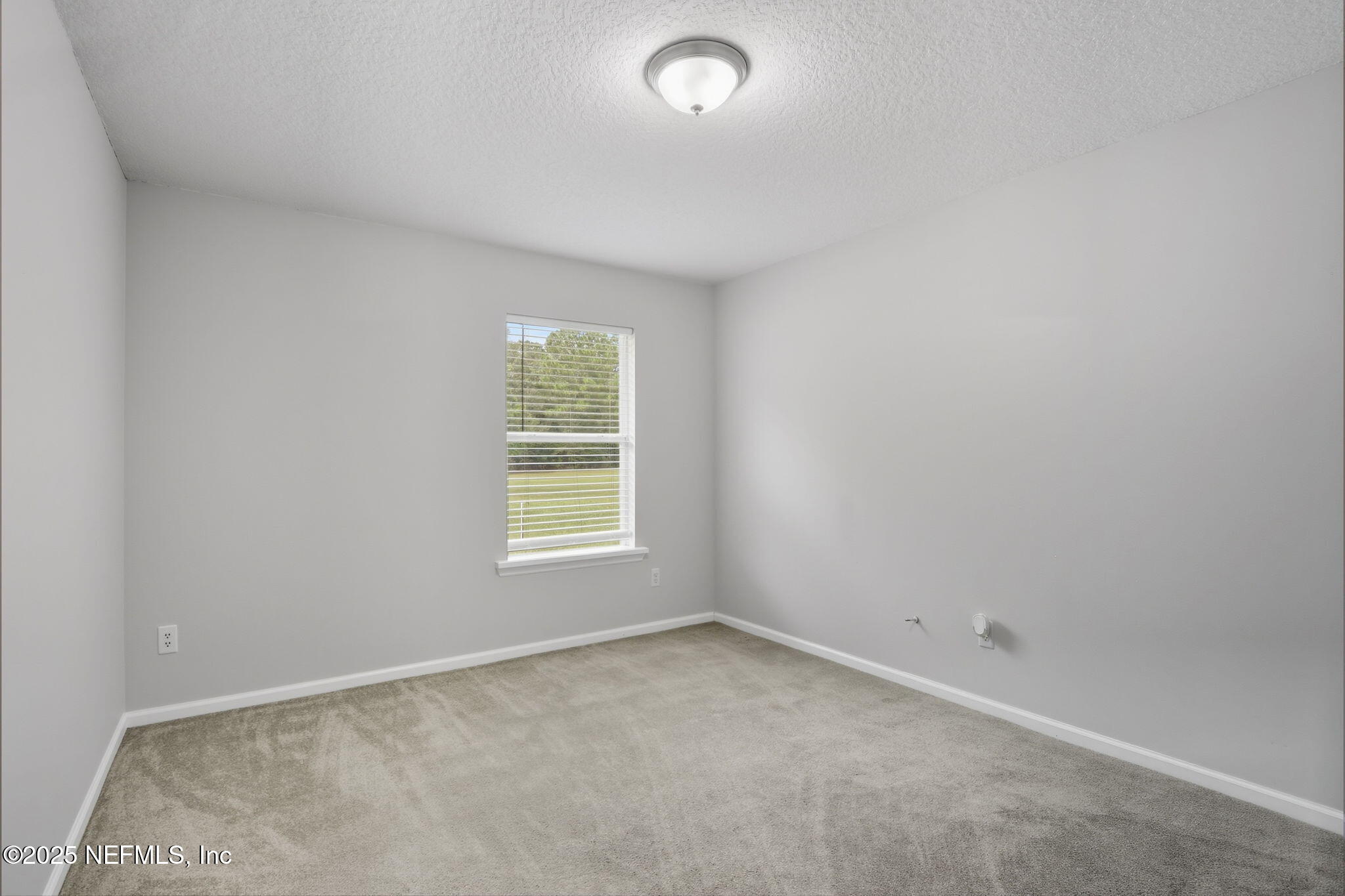 2064 Louie Carter Road Jacksonville, FL 32234 - Photo 36 of 46 an empty room with a window