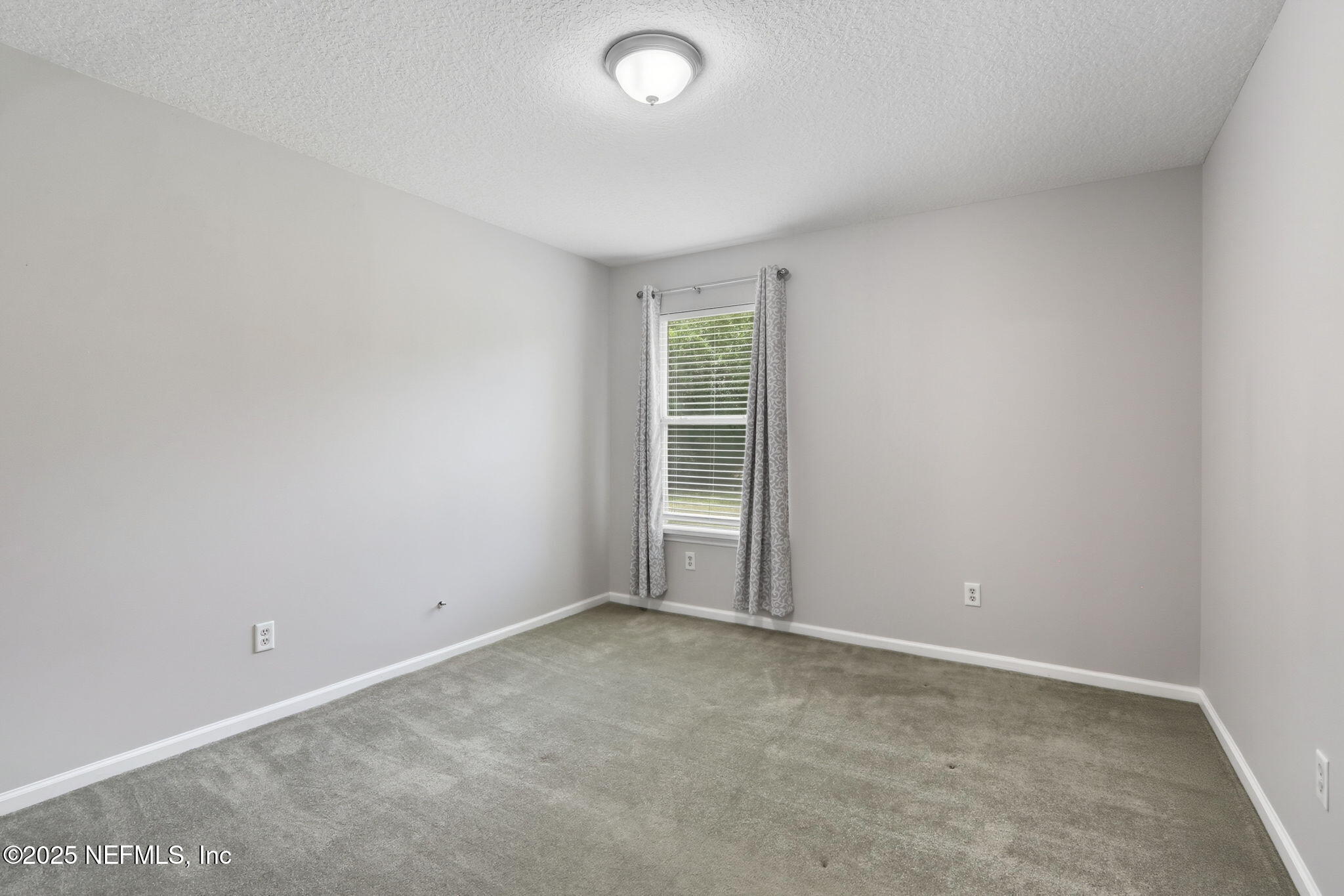 2064 Louie Carter Road Jacksonville, FL 32234 - Photo 38 of 46 an empty room with a window