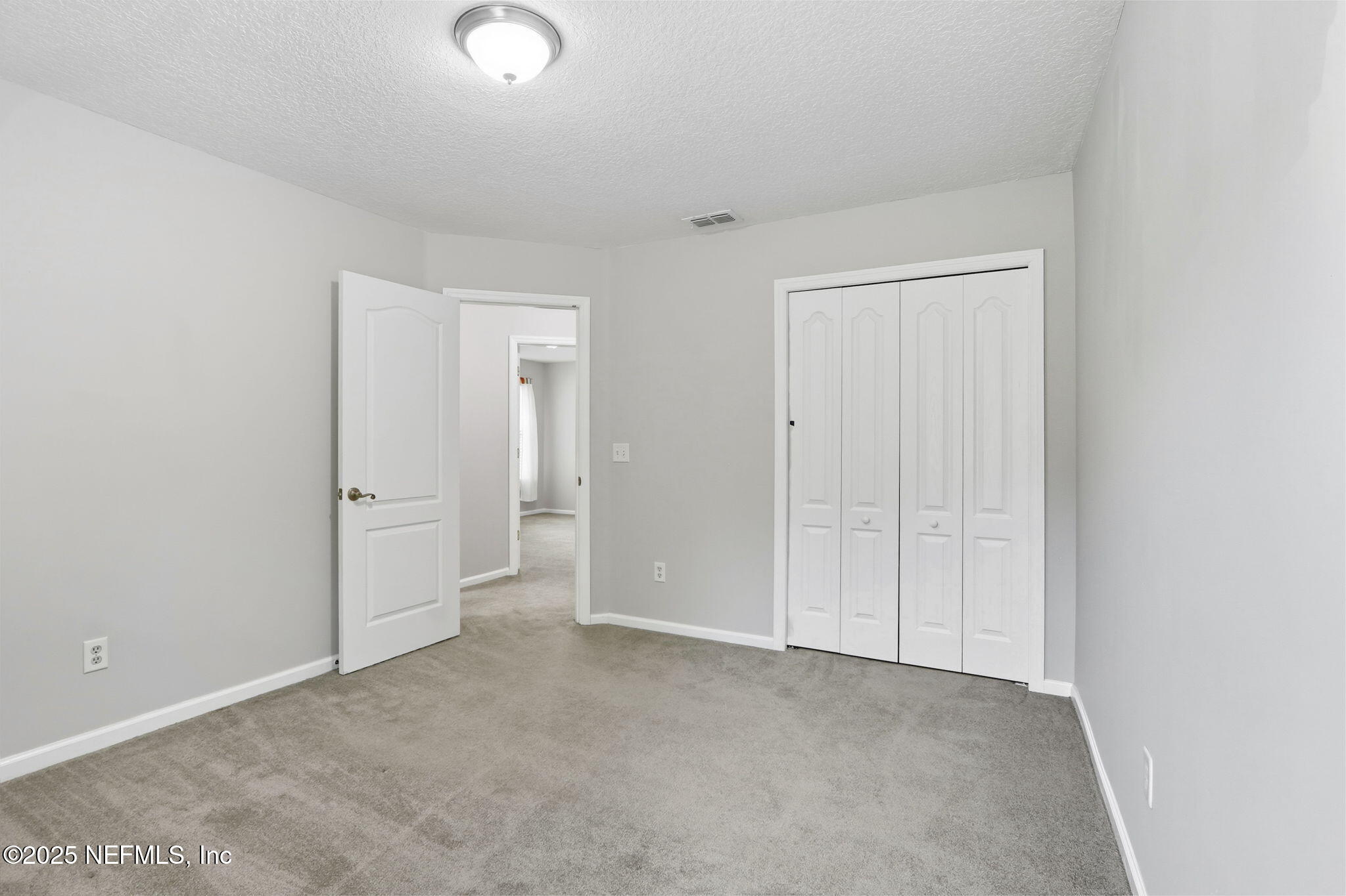 2064 Louie Carter Road Jacksonville, FL 32234 - Photo 39 of 46 an empty room with closet area