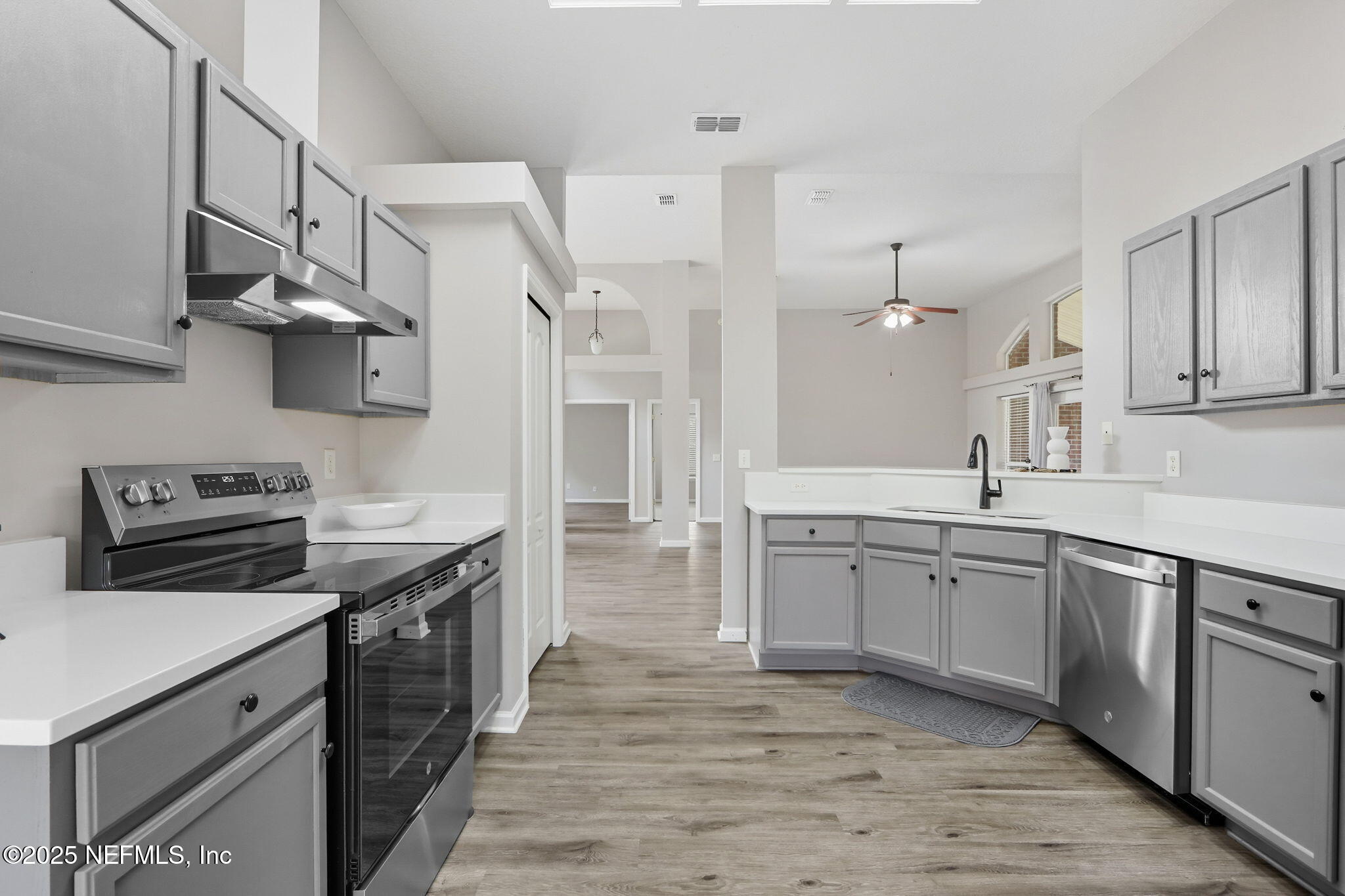 2064 Louie Carter Road Jacksonville, FL 32234 - Photo 6 of 46 a kitchen with cabinets and stainless steel appliances