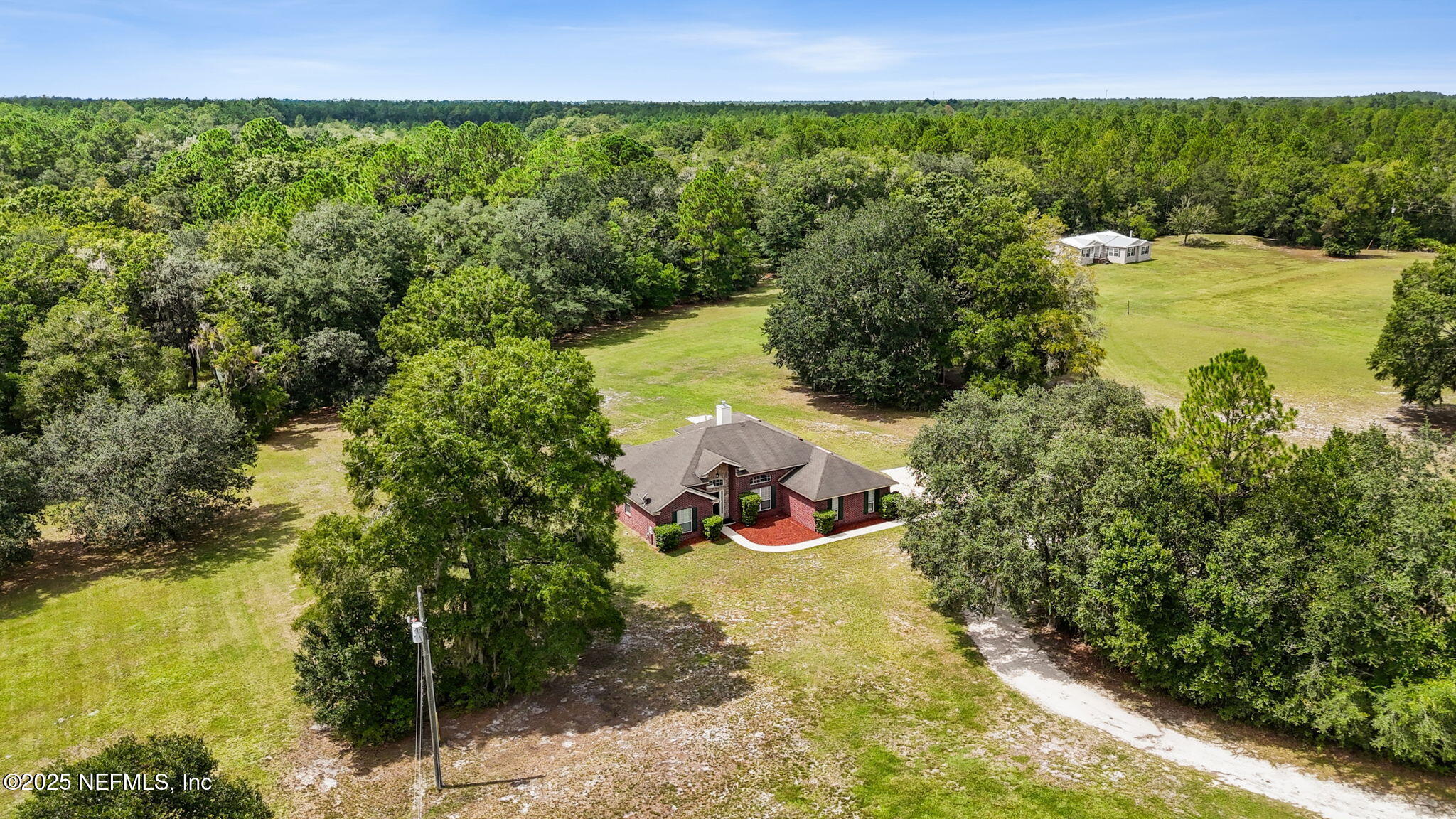 2064 Louie Carter Road Jacksonville, FL 32234 - Photo 9 of 46 a view of a garden with lawn chairs