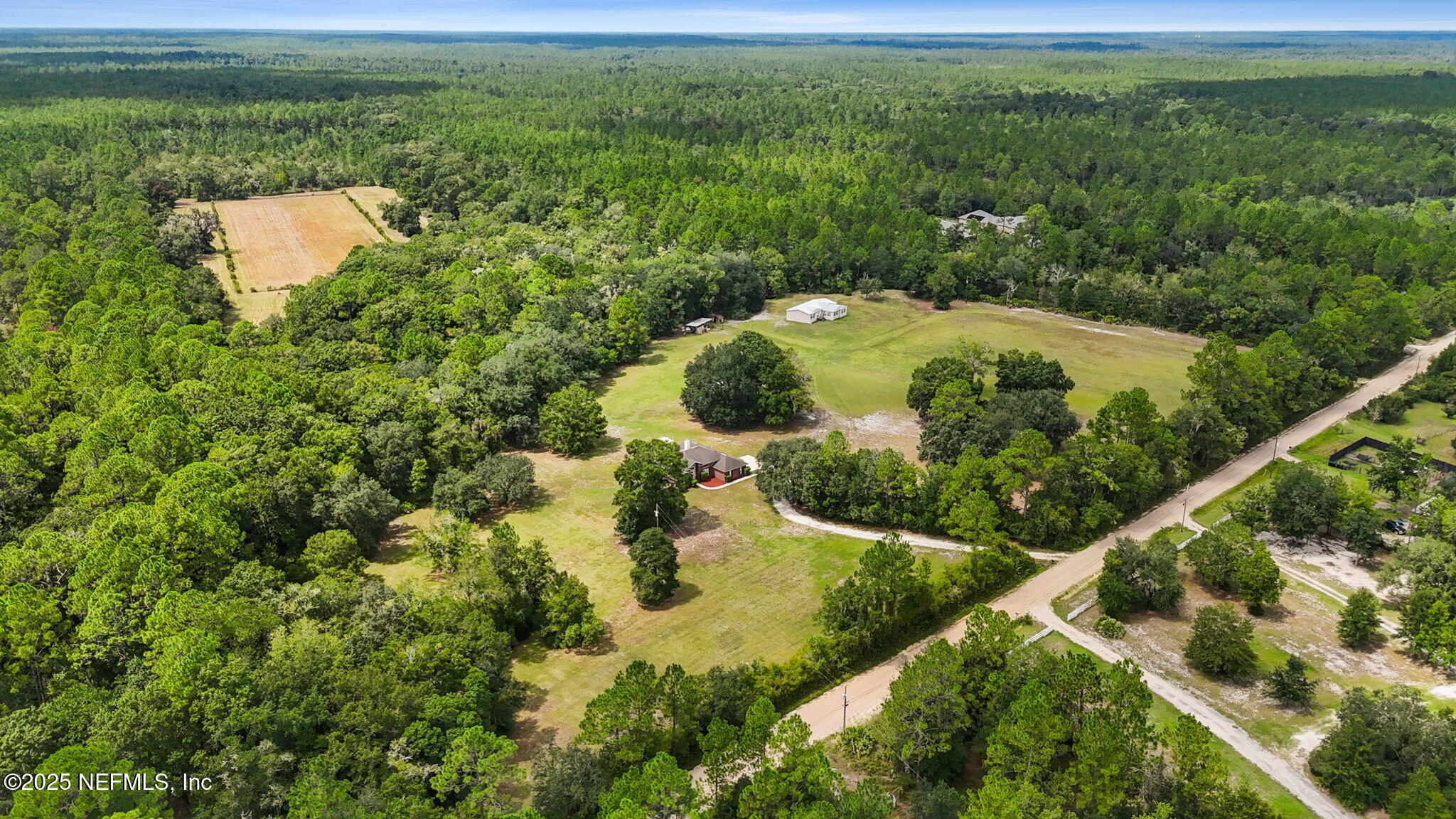 2064 Louie Carter Road Jacksonville, FL 32234 - Photo 10 of 46 a view of a garden with a lake